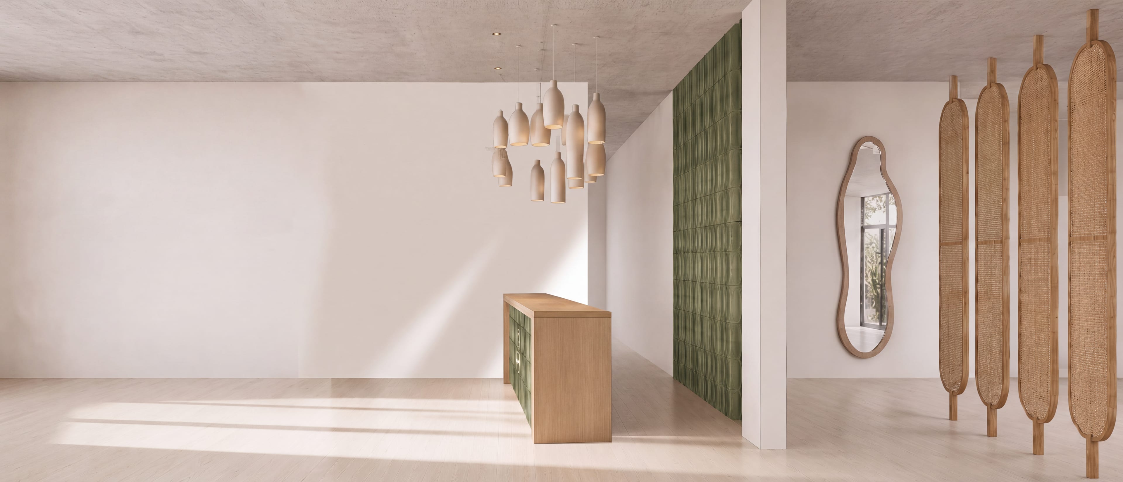 The reception with a wooden counter, a green tiled wall and ceramic lamps
