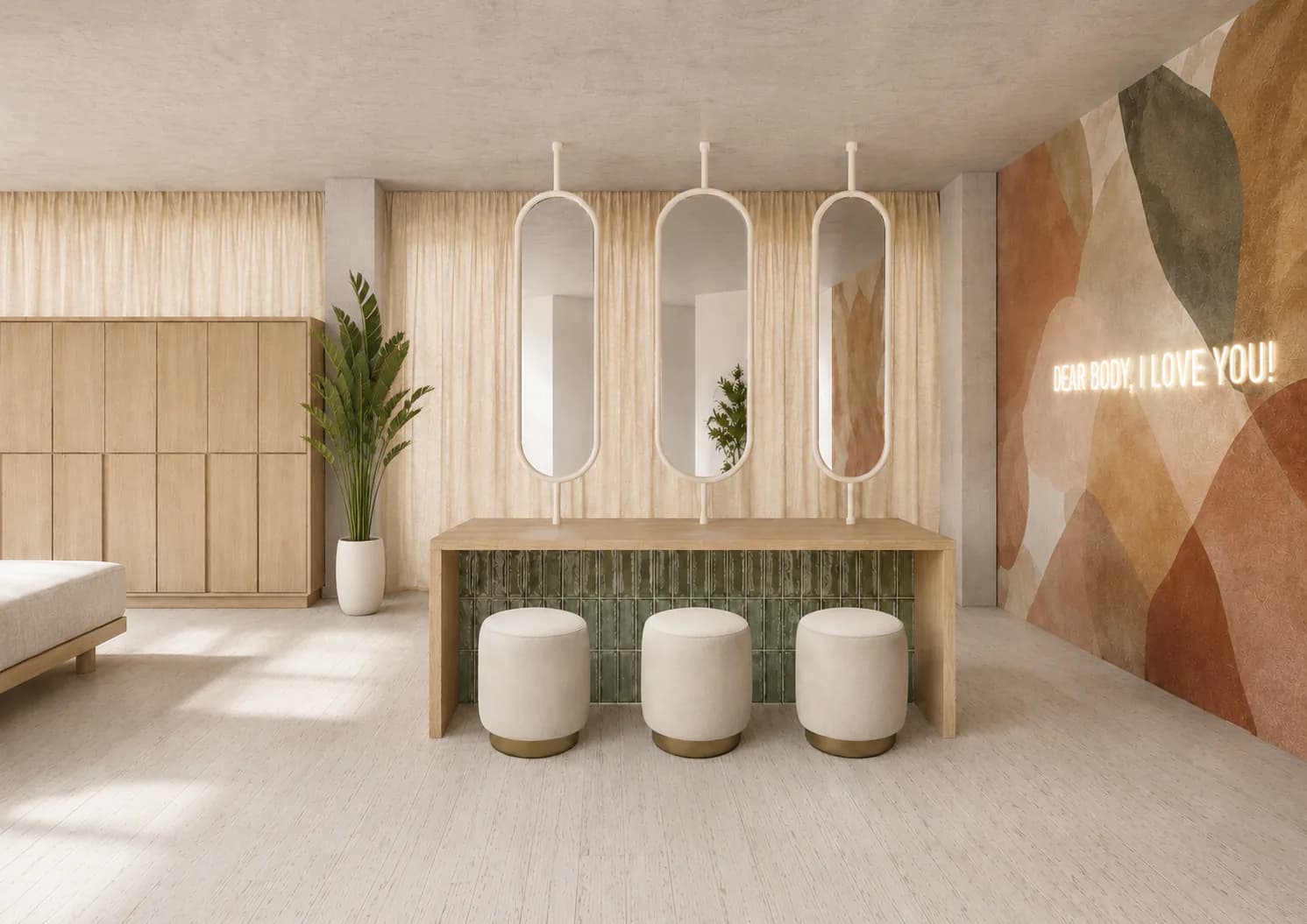 The hair-drying station with oval mirrors, stools and the neon sign “Dear Body, I love you!”